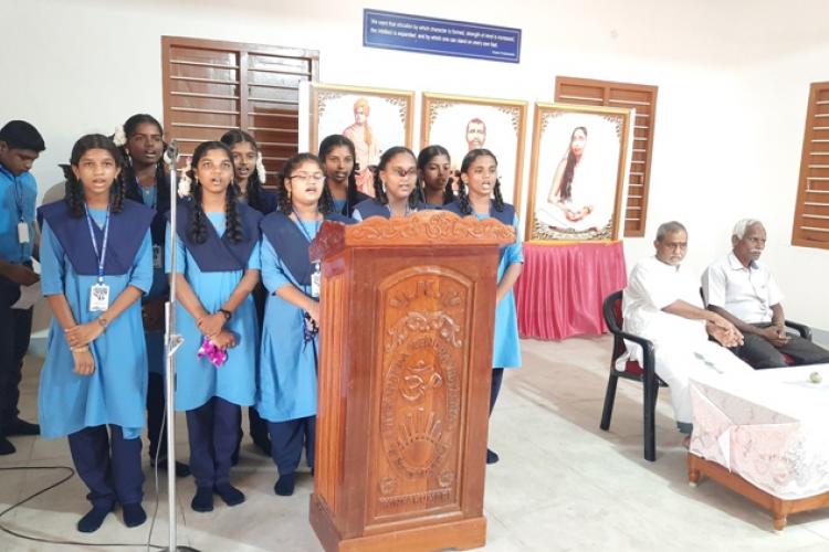  IX std girls singing a melodious song praising the master of the day,Man.EknathRanade. 