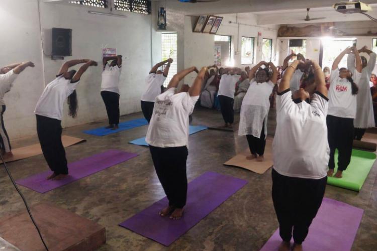 Yoga practice during Samatva Yoga Sangamam at Madavana