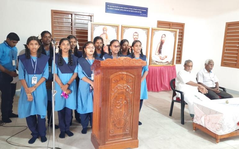  IX std girls singing a melodious song praising the master of the day,Man.EknathRanade. 