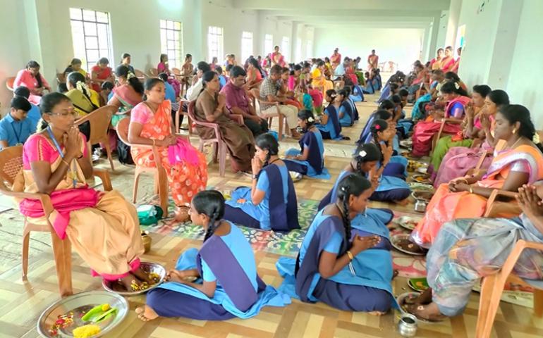 Students doing Paatha Pooja to their parents
