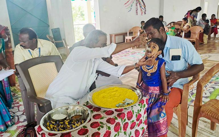 Sri Ayyappan Ji doing Vidyarambham for a child at VKV Vallioor
