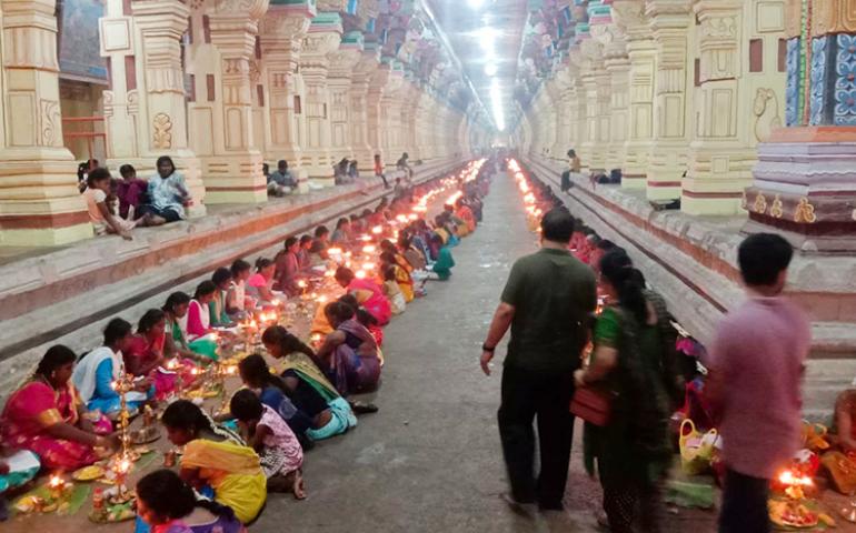 Participants performing puja at the mass Thiruvilakku Puja in Rameswaram