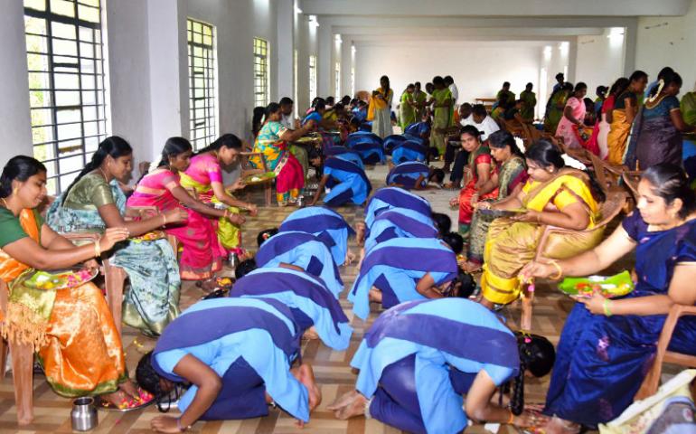 Parents blessing children during Matru Puja at VKV Vallioor