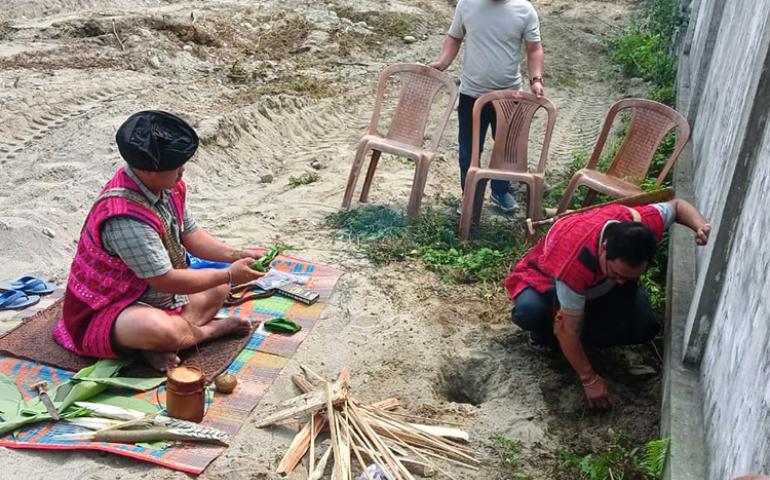 Pujari performing Bhoomi puja rituals at Tezu