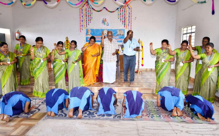 Teachers blessing students during Matru Puja at VKV Vallioor