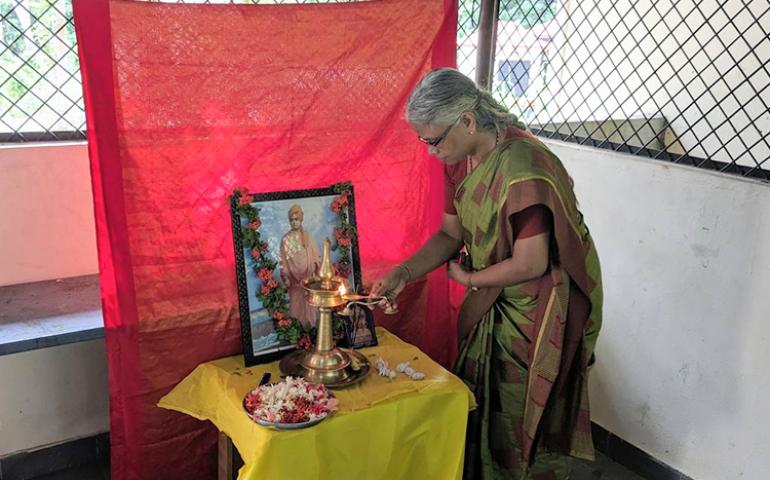 – Ma Radha Didi lighting the lamp at Amrit Parivar Sangamam